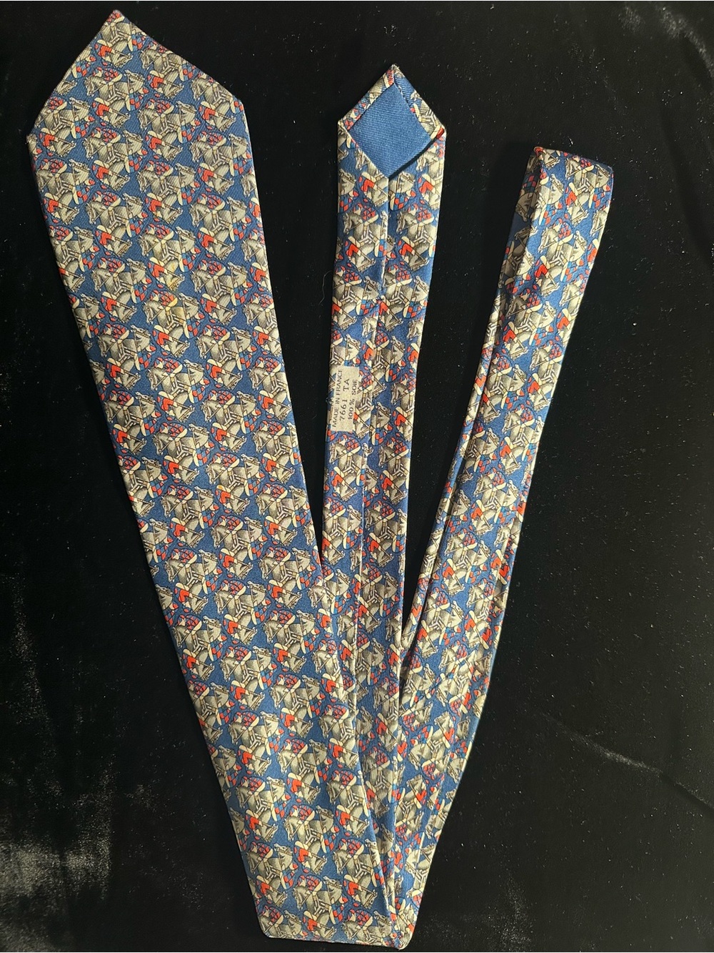 Hermes Blue Geometric Silk Tie with Red and Cream Accents